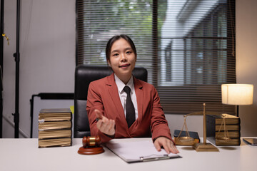 Female lawyer in office, Corporate lawyer at workspace, Attorney with legal books and gavel,