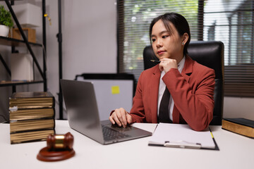 Female lawyer in office, Corporate lawyer at workspace, Attorney with legal books and gavel,