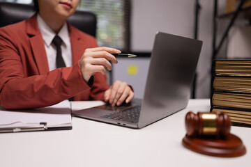 Female lawyer in office, Corporate lawyer at workspace, Attorney with legal books and gavel,