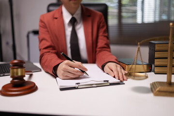 Female lawyer in office, Corporate lawyer at workspace, Attorney with legal books and gavel,