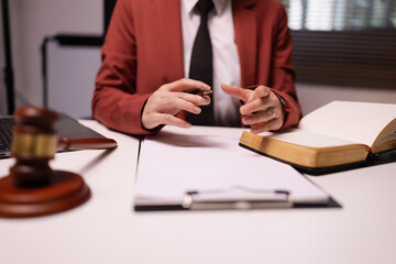 Justice and laws concept. Lawyer businesswoman with law book in a modern office,