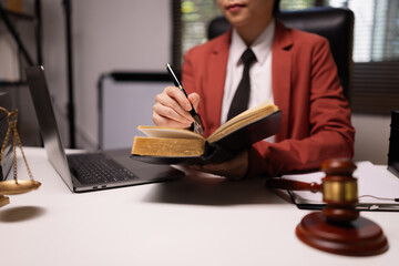 Female lawyer in office, Corporate lawyer at workspace, Attorney with legal books and gavel,