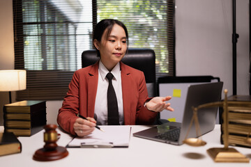Female lawyer in office, Corporate lawyer at workspace, Attorney with legal books and gavel,