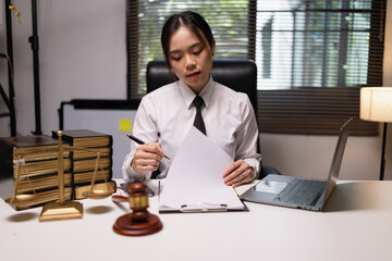 Female lawyer in office, Corporate lawyer at workspace, Attorney with legal books and gavel,