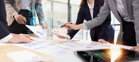 Team analyzing financial data and creating business strategies using digital tools.