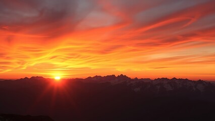 Snowy mountain peaks bathed in golden sunset light, capturing alpine beauty.