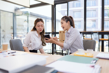Two businesswoman colleagues having a casual conversation during a coffee break, Informal business meeting for new ideas and collaboration.