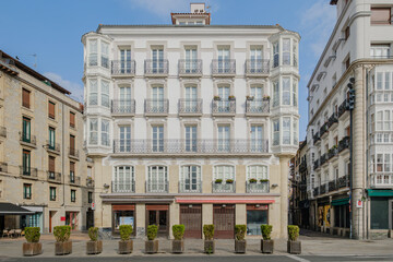 Traditional Basque Architecture With White Glass Enclosed Balconies And Wrought Iron Details In Northern Spain. Historic Building, Urban Architecture