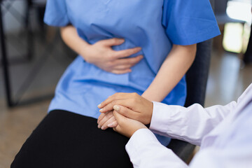 Professional encouragement, Doctor reassuring and supporting her colleague or junior staff member,...