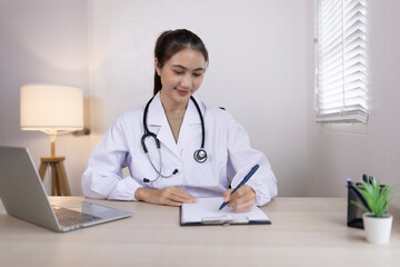 Medical professional using a computer for online patient support, Medical professional and Healthcare technology Concept.