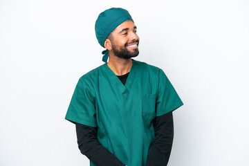 Surgeon Brazilian man in green uniform isolated on white background looking side