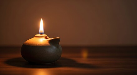 Warm, muted light from a simple oil lamp