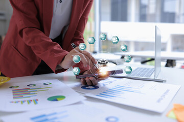 Hand of businesswoman holding a pen, discussing marketing analytics at the office.