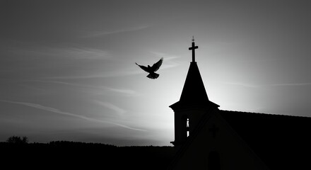Silhouette of a dove in flight near a church steeple against a dramatic sky