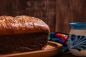 Salvadoran egg bread, accompanied by a cup of hot chocolate.Salvadoran yolk bread, accompanied by a cup of hot chocolate.
