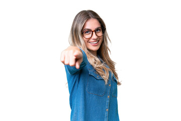 Obraz na płótnie Canvas Young Uruguayan woman over isolated background pointing front with happy expression