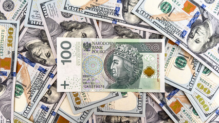 100 US Dollar Bills and 100 Polish Zloty Banknote – Currency Exchange, Forex, Global Finance Concept