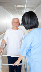 Fototapeta premium Nurse assisting elder people in a rehab facility gym