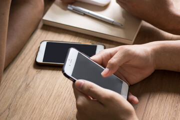 group of people holding a smartphone with both hands, with a dark screen displaying, network connections visualized