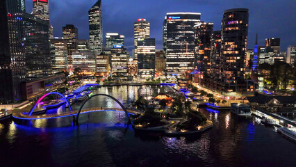 Elizabeth Quay waterfront and modern bridge in Perth city captured from above during night time