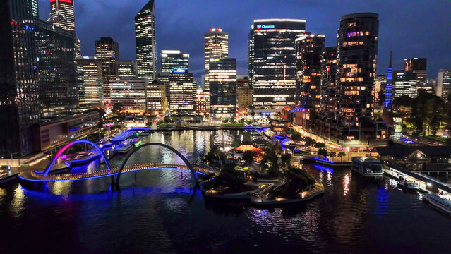 Elizabeth Quay waterfront and modern bridge in Perth city captured from above during night time