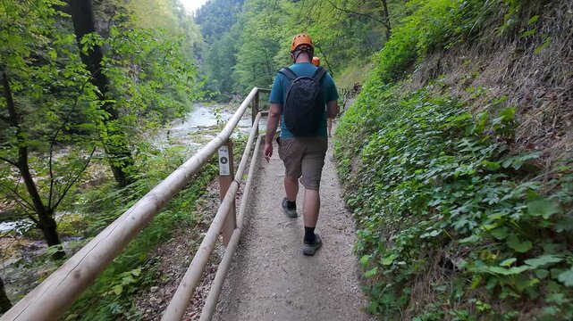 People hiking the wooden walkways in the Vintgar Gorge, Slovenia.