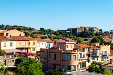 View of colourful Collioure, narrow streets and yellow, pink, orange houses, summer vacation destination town with historical buidings and beaches, Pyrenees-Orientales, France