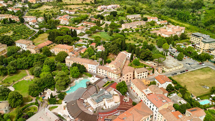 Fototapeta premium Aerial view of the historic center of Casciana Terme, Pisa, olive trees and vineyards in the background