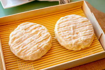 French cheeses collection, soft round white Saint-Felicien cow's milk cheese with white mold from Rhone-Alpes region of France