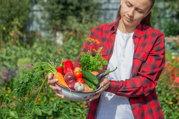Fototapeta premium Girl Holding a Bowl of Fresh Organic Vegetables