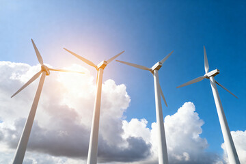white wind turbines standing in a vast open field under a clear blue sky, symbolizing clean energy, renewable power, and a sustainable future.Generated by AI