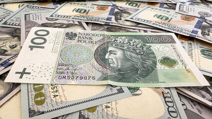 Polish Zloty Banknote on US Dollar Bills – Currency Exchange and Global Finance Concept