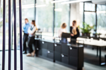 Blurred office background with employees