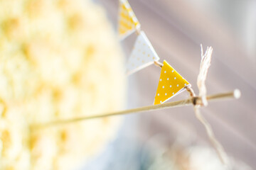 decorative white and yellow paper flags
