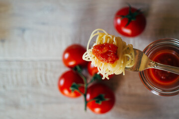 fork with noodles and tomato sauce from above