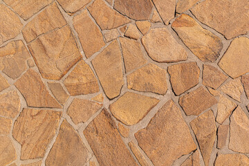 Abstract background stone laying of the road surface. sample of pavement of paths in a park, country house. environmentally friendly natural material