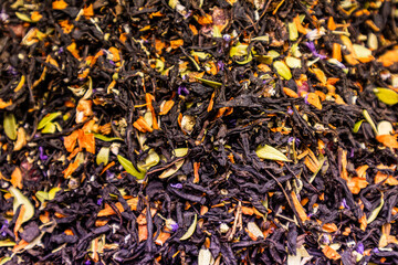 Dry flower tea made from several types of flowers and tea leaves. delicate floral aroma of fermented tea. Gorgeous taste. selective focus