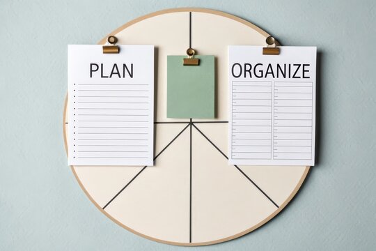 Flatlay of Plan and Organize Papers on a Circle Board