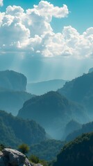 Misty mountains with glowing sunbeams