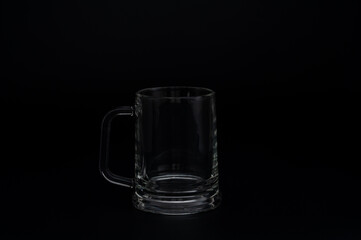 Empty Glass Beer Mug on Black Background