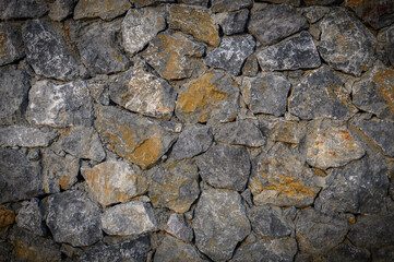 Mediterranean rustic stone wall with warm tones