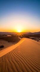 Sunrise over gently sloping sand dunes, creating a warm, inviting landscape