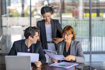 Group of managers or business workers share heir happiness after achieving project target. A moment...