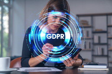 Woman using smartphone in office setting with GDPR digital interface overlay illustrating data protection and privacy concept on blurred background.