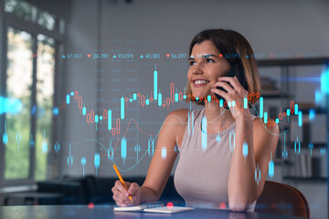 Woman smiling while talking on phone and analyzing stock market data overlay in modern office background, showcasing financial success concept.