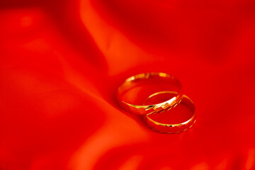 silk wedding, gold wedding rings on red silk
