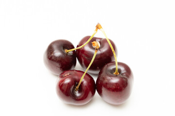 Background filled with the close-up details of ripe maroon cherries