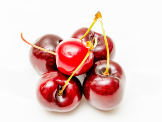 Background filled with the close-up details of ripe maroon cherries