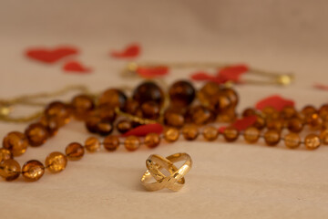 gold wedding rings macro on an amber background, amber wedding, 34th wedding anniversary