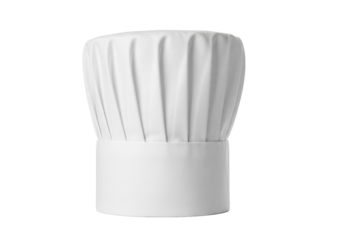 A tall white pleated chef s hat also known as a toque blanche stands upright against a stark black background symbolizing culinary expertise and professional cooking